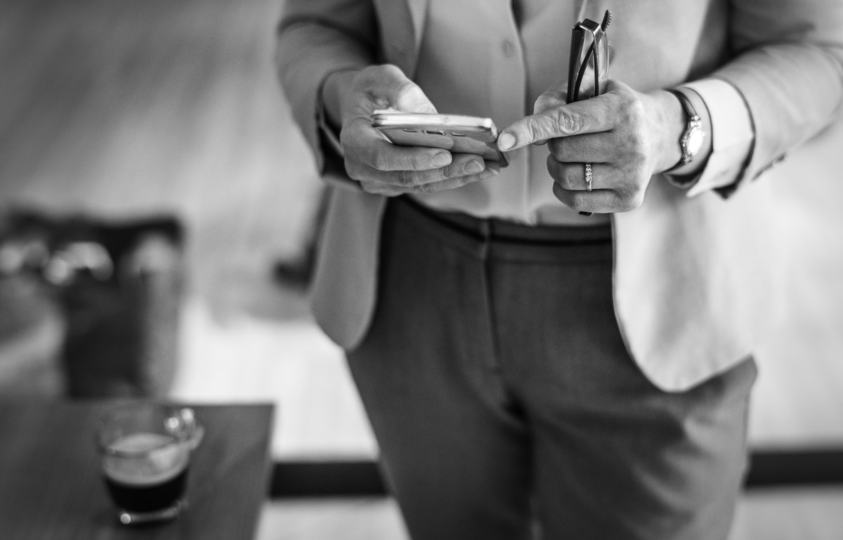 man looking at email marketing on mobile phone