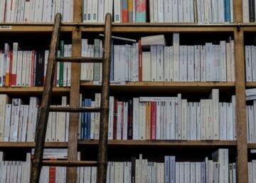 Brown Wooden Ladder on Brown Wooden Bookshelf