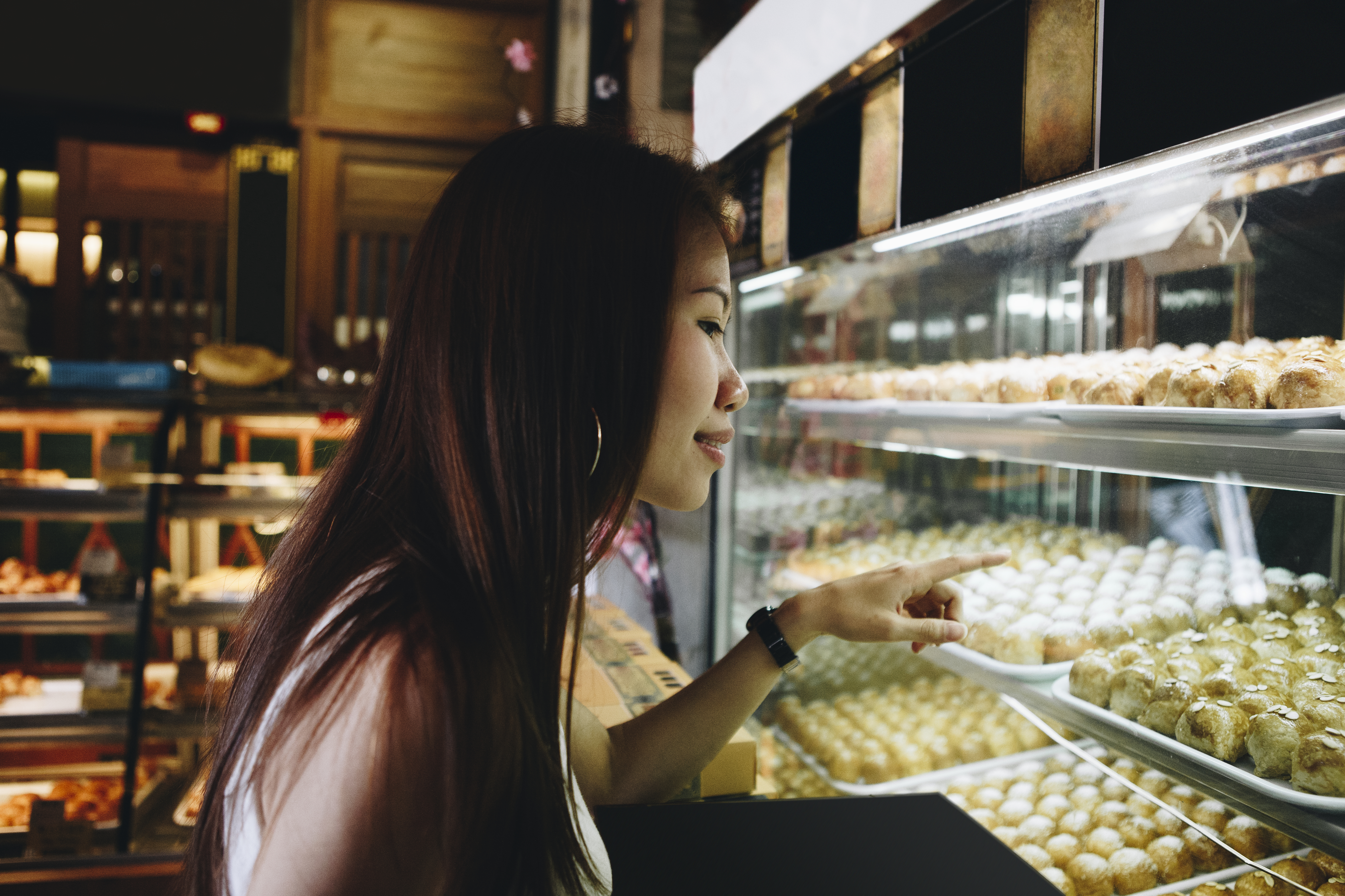 girl pointing at pastries