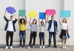 group of young professionals holding thought bubbles